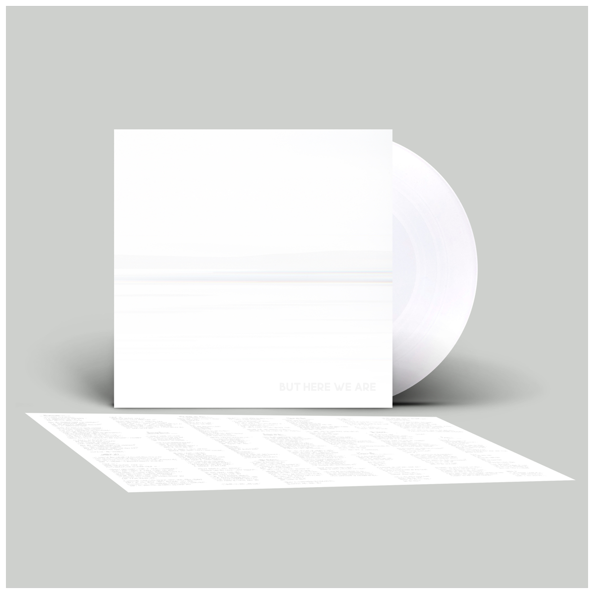 White envelope with a smaller white card inside on a light gray background