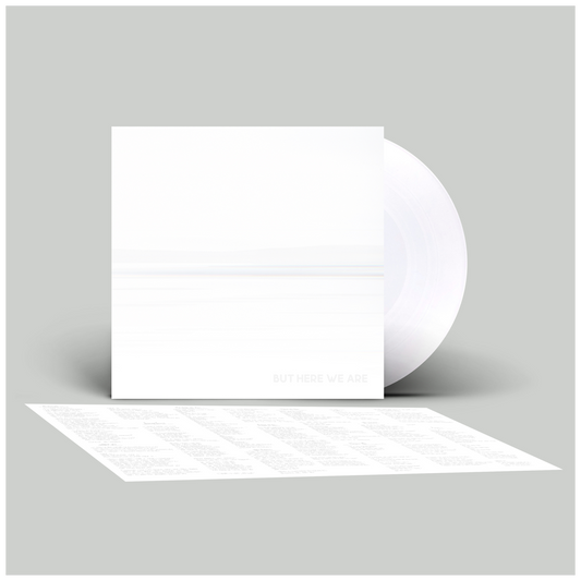 White envelope with a smaller white card inside on a light gray background